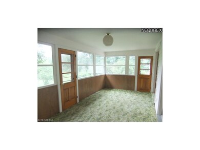 Sunroom located off the kitchen offers great views