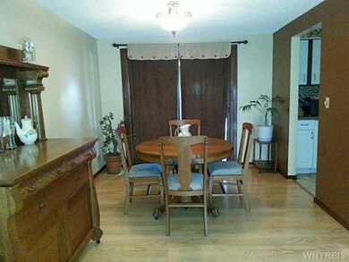 Dining Room. Laminate floors and slider to 3 seaso