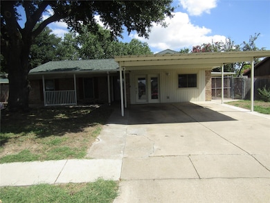 View of front of home with a carport