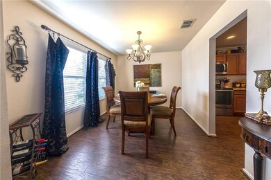 Beautiful formal dining room with wood look floori