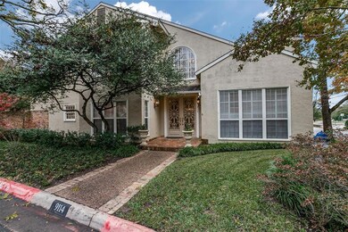 Landscaped entry, with wide sidewalk, is welcoming