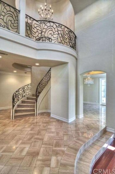 Tall Vaulted ceilings and wrought iron Stair case 