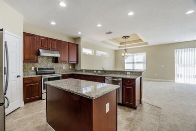 Kitchen and great room view from hallway in the fr