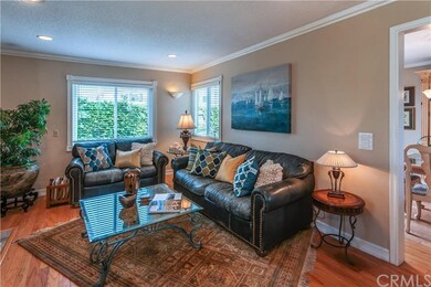 The elegant living room with hardwood flooring als