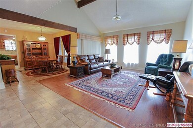 The big living room has a vaulted, open beam ceili