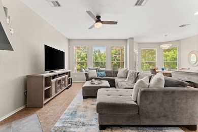 Living room featuring light tile patterned floors