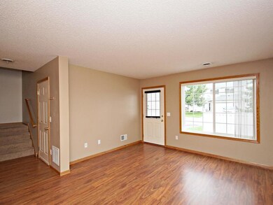 Walk out to the private patio from the living room