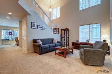 Formal living room w two story windows