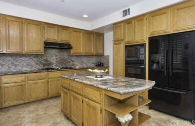 granite counters and backsplash make cooking fun