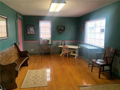 Front room with hardwood floors.