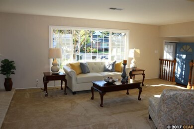Open & bright with Fireplace.
