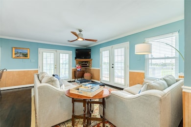 Living space with entrance to home and front deck.  Tons of natural light.