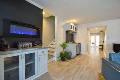 Electric fireplace provides ambiance and warmth. C