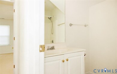 Bathroom featuring vanity and a shower
