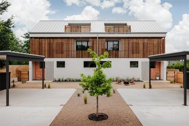 View of front of property featuring fence, a pati