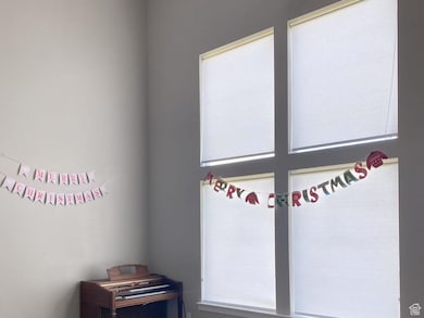 Carpeted empty room featuring baseboards