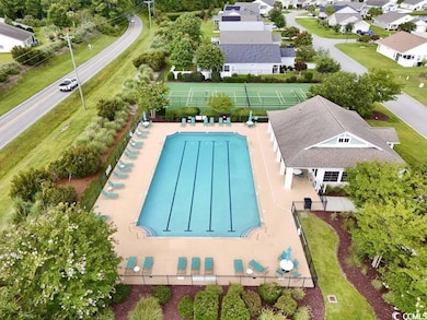 Aerial perspective of suburban area featuring a pool area