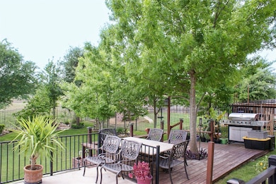 Wooden deck featuring a yard, a fenced backyard, 