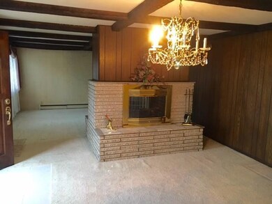 Neutral Carpeting and dual Fireplaces.
