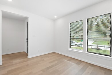 Front study with bronze framed window accent.