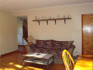Natural woodwork in living room and throughout the