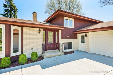 2 car attached garage and concrete driveway with a