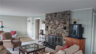 Stone wood burning fireplace in...
