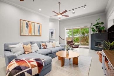 Living area with ceiling fan, track lighting, cro