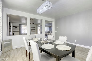 Dining area featuring light wood finished floors a