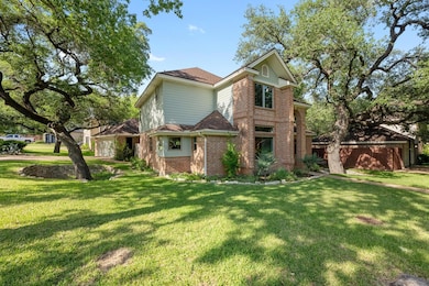 Traditional home featuring brick siding and a fro