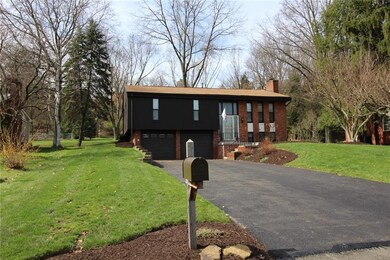 THE STONE RETAINING WALL ALONG THE DRIVEWAY WAS IN
