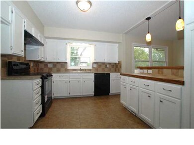 KITCHEN HAS TILE FLOORING, WITH NEW PAINT, COUNTER