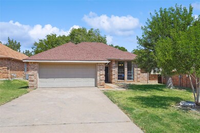 Single story home with a front lawn and a garage