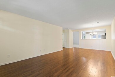 Unfurnished living room with a textured ceiling, h