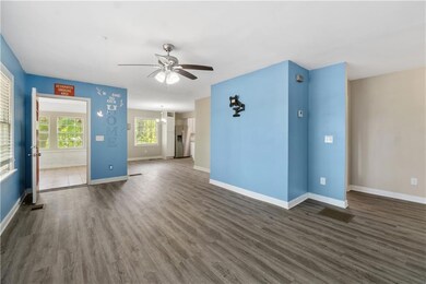 Unfurnished living room with dark wood finished fl