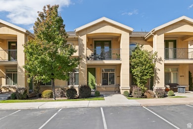 View of property featuring uncovered parking