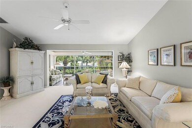 Living room with light colored carpet, high vaulte