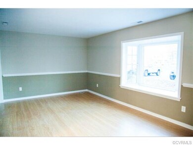 Family room, brand new laminate wood flooring, bay