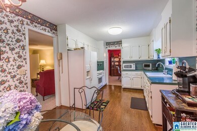 EFFICIENTLY DESIGNED KITCHEN WITH AMPLE STORAGE AN