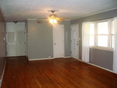 Coat closet, original hardwood floors and large wi