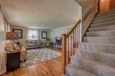 Gorgeous hardwood floors lead you into the family 