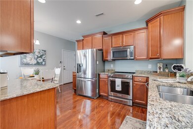 Kitchen Area with Beautiful Wood Cabinetry.