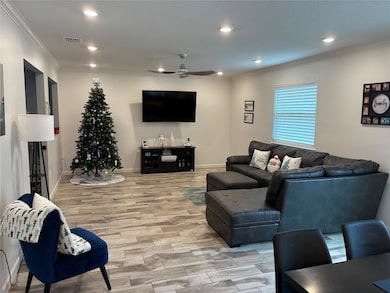 Family room-tile flooring-crown molding- recessed lighting