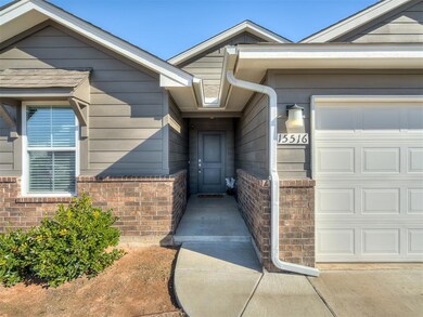 View of exterior entry with a garage