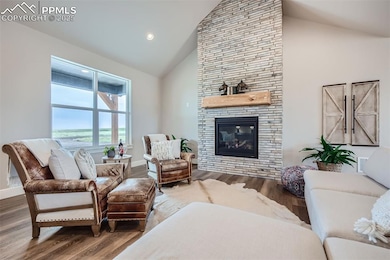 Great Room with a floor-to-ceiling Stone Fireplace
