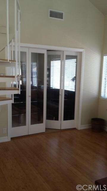 Downstairs master with glass accordion doors, this