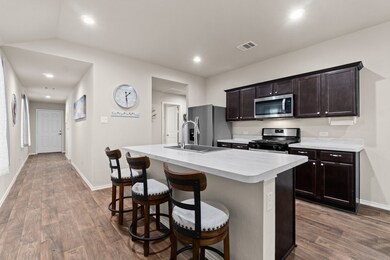 This kitchen island is the perfect spot for entertaining and food preparation space.