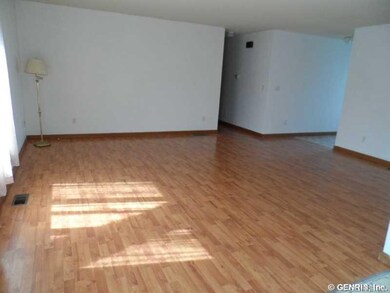 Living Room. Sunlight fills the room with windows 