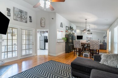 Living room with hardwood / wood-style flooring, a