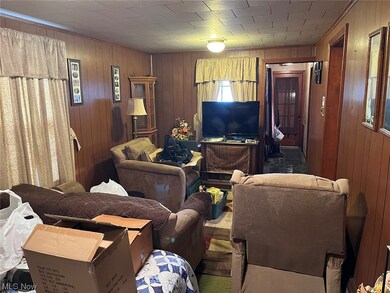 Living room with wood walls